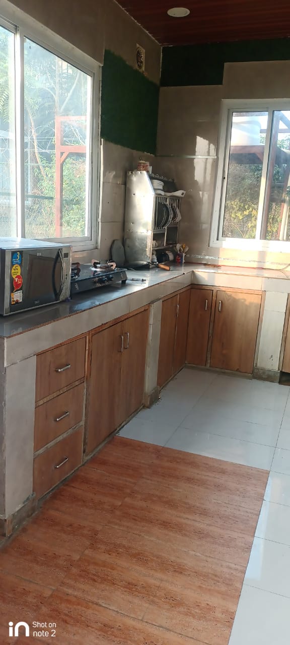 Kitchen at Angle Farmhouse Sector 151 Noida