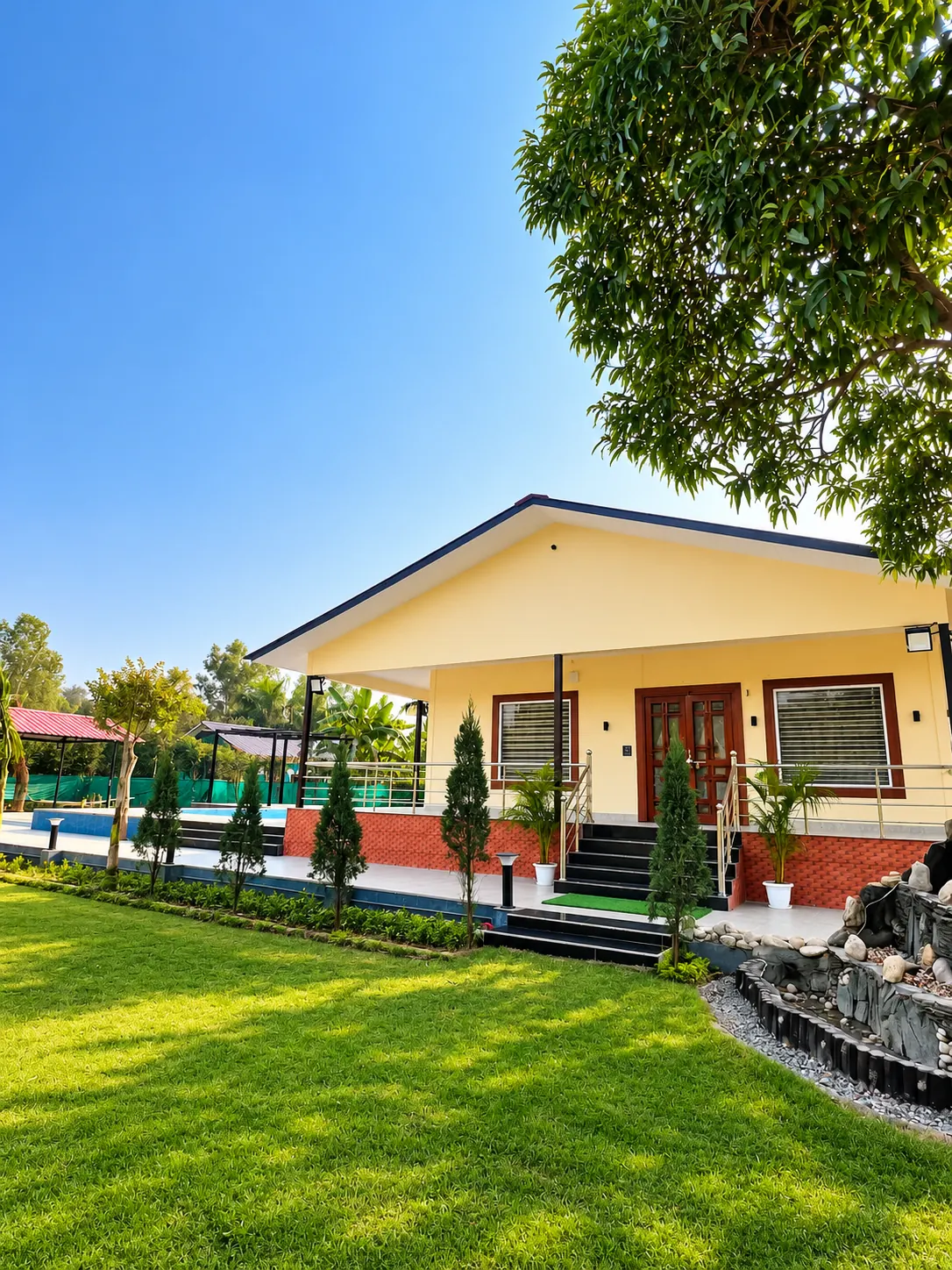 Devansh Farmhouse Sector 135 Noida exterior with landscaped lawn