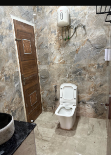 Bathroom with modern fittings at Expostay Farm Sector 151 Noida