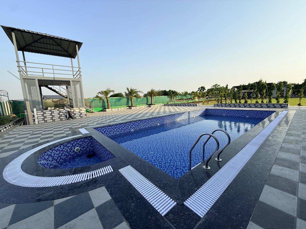 Swimming pool at Royal Retreat Farmhouse