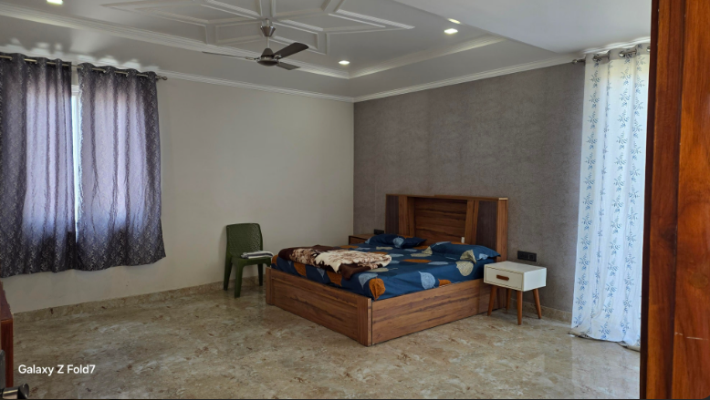 Comfortable bedroom at Shree Hans Farmhouse Noida
